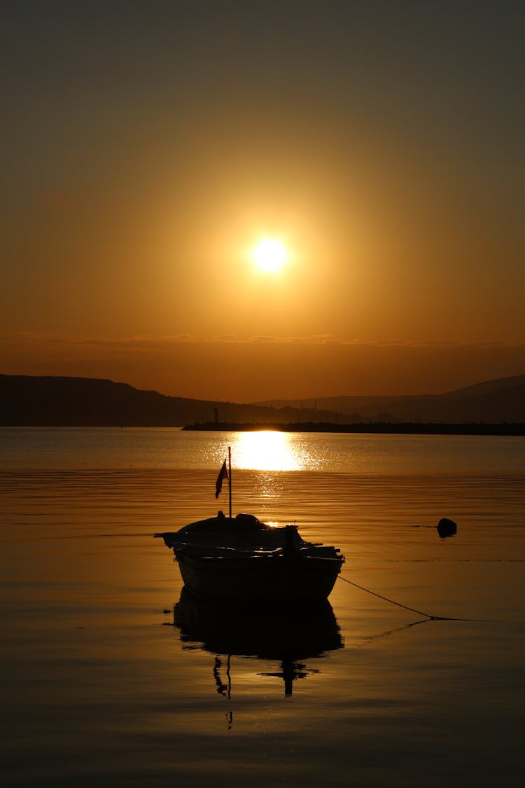 Silhouette Of A Rowboat During Sunset 