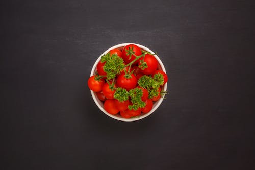 Red Tomatoes in White Ceramic Bowl