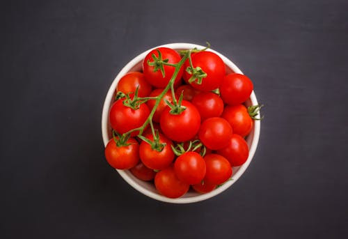 Free Close-Up Shot of Red Tomatoes on White Ceramic Bowl Stock Photo