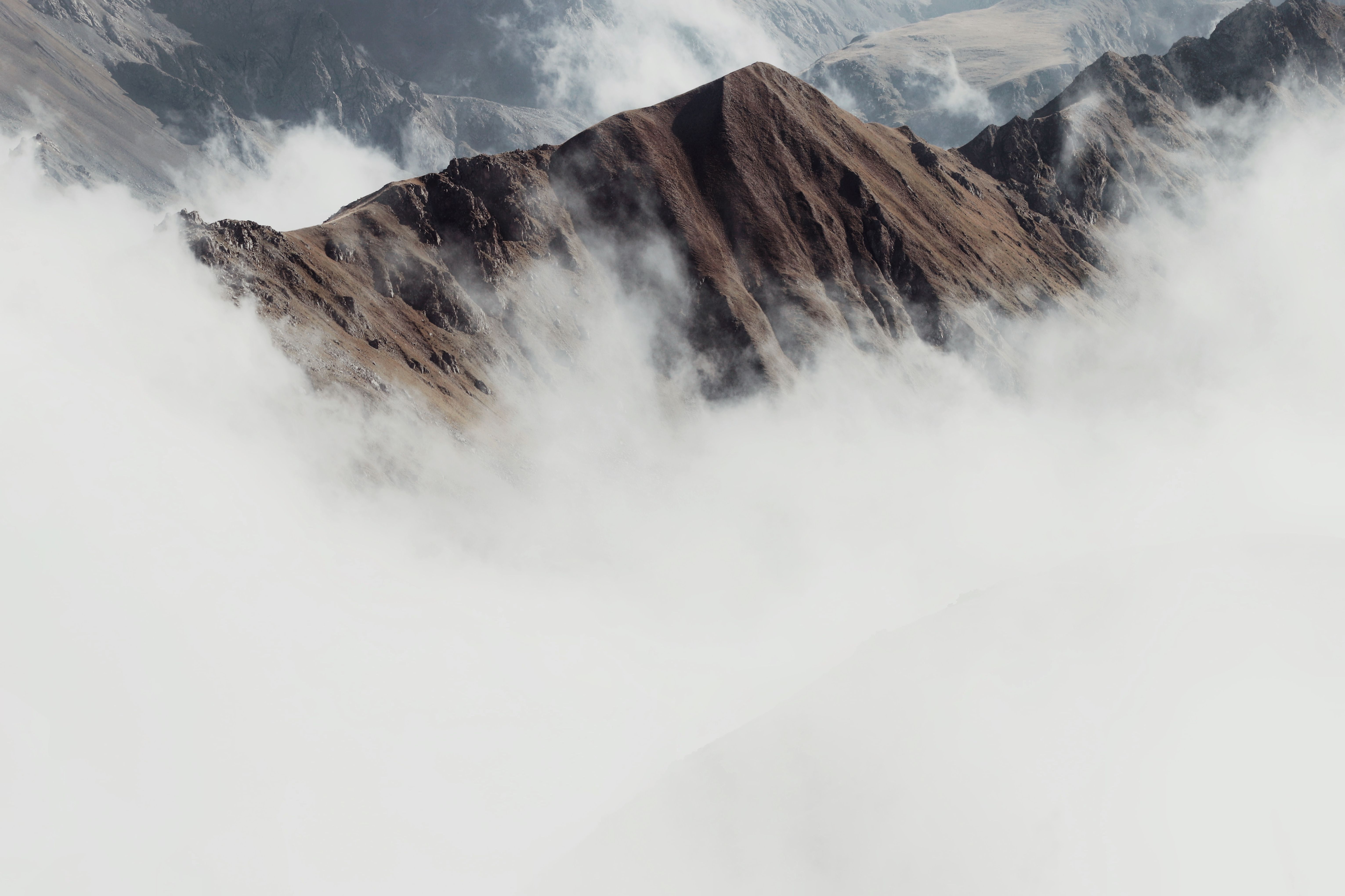 White Clouds Over a Mountain · Free Stock Photo