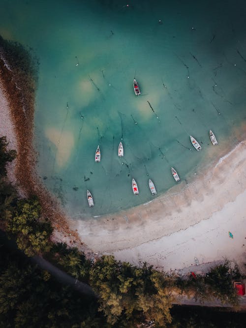 Free Boats Anchored on the Beach Area Stock Photo
