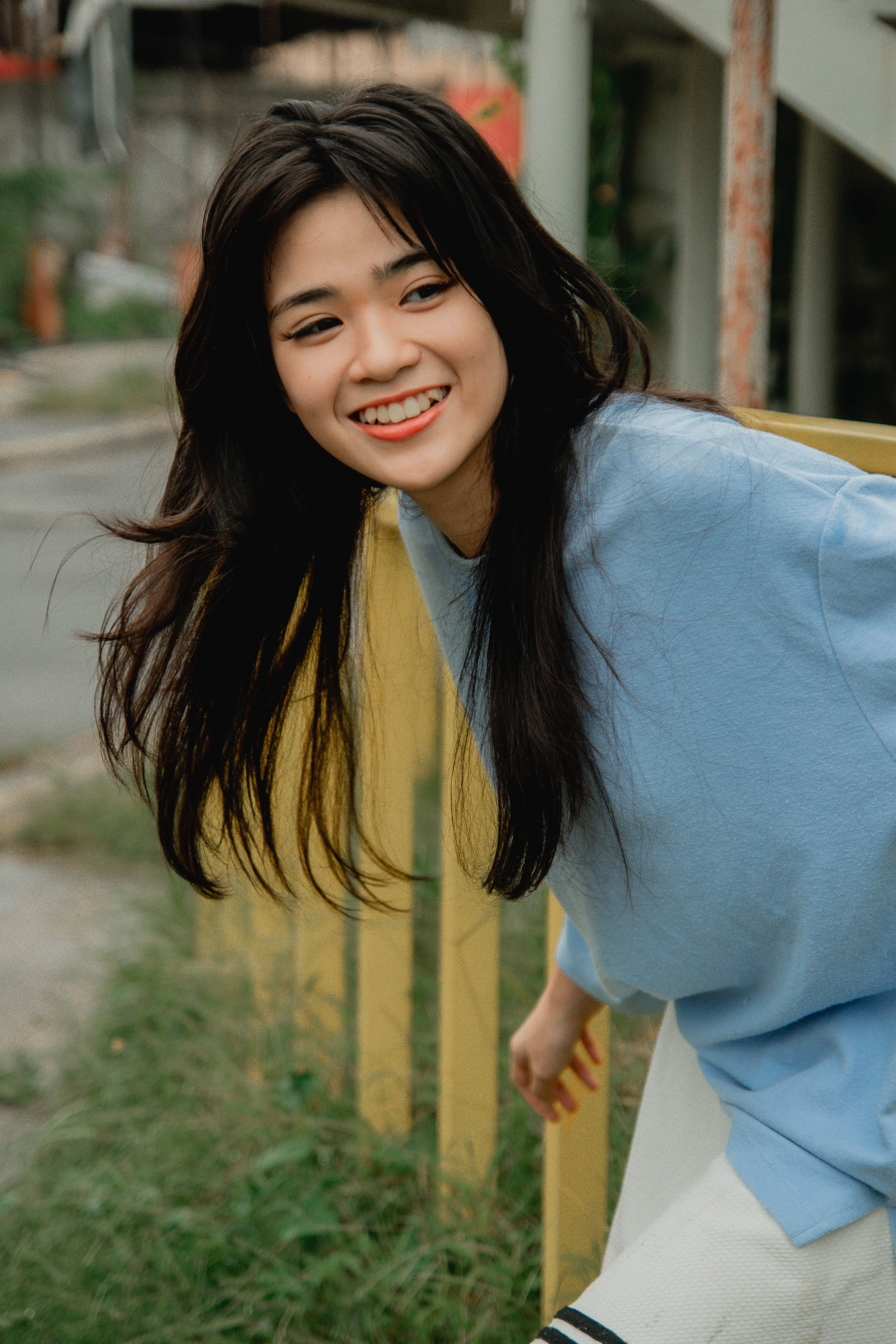A Woman in Blue Long Sleeve Shirt Smiling · Free Stock Photo