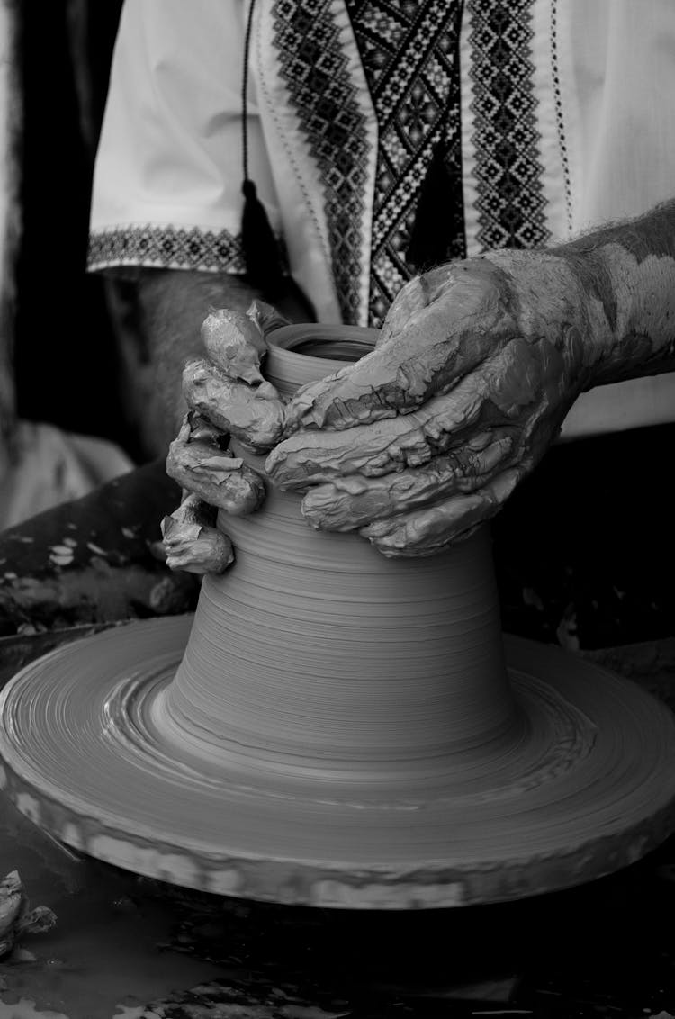 A Person Making Clay Pot