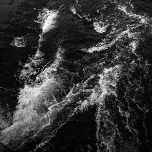 Grayscale Photo of Waves in the Ocean