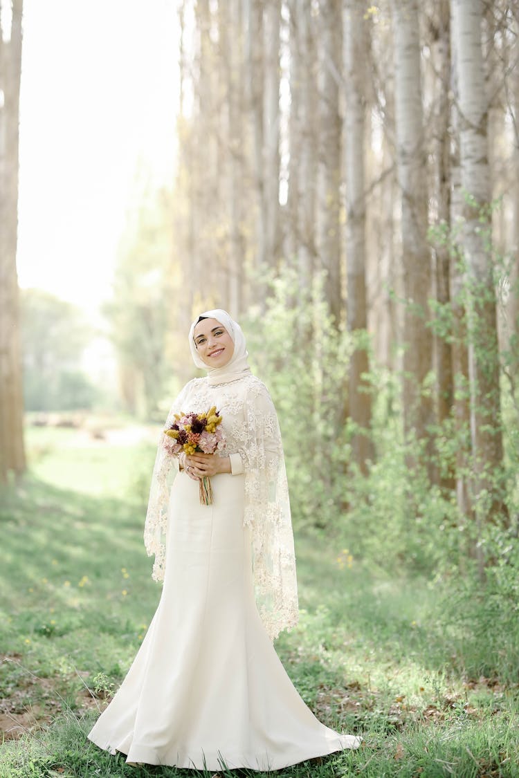 Woman In Traditional Wedding Clothes In Park