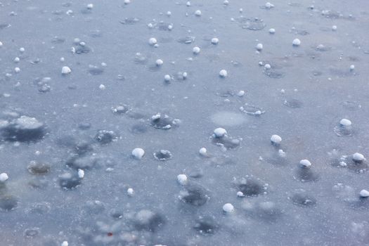 Hail Balls After Heavy Rain Lying on Ice