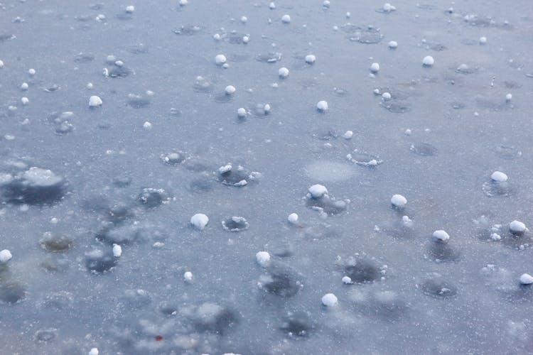 Hail Balls After Heavy Rain Lying On Ice