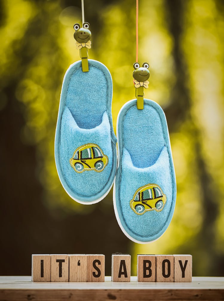 Pair Of Hanging Baby Slippers And Letter Blocks With Inscription
