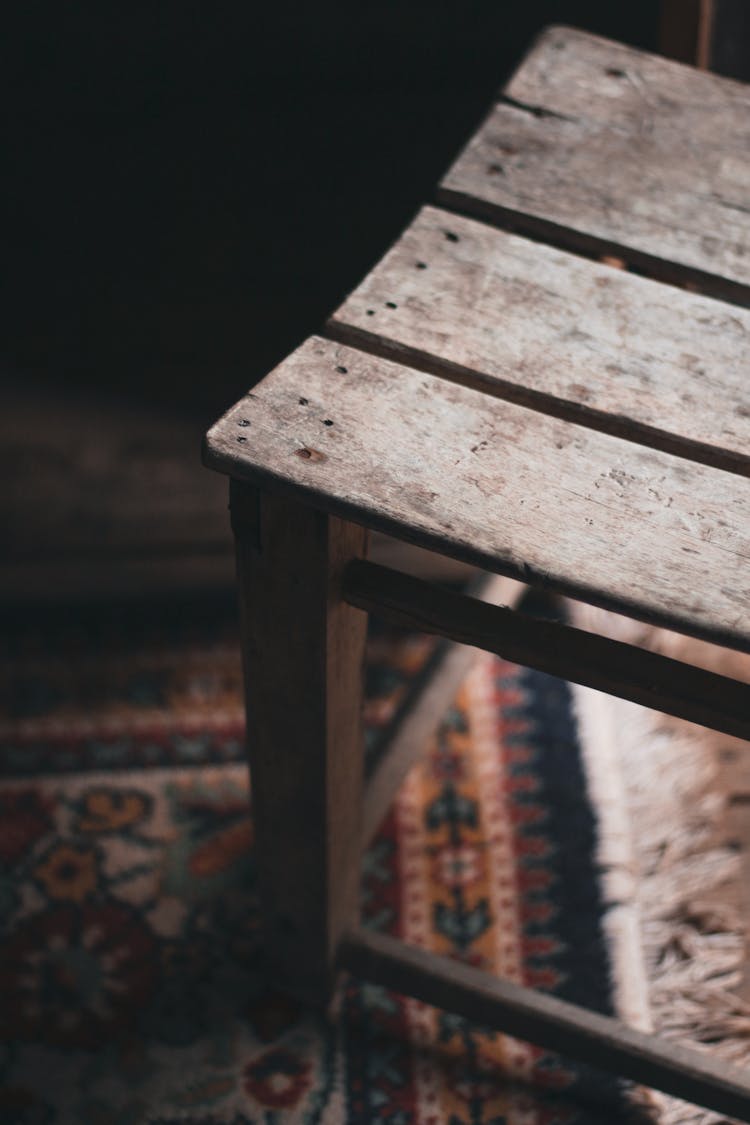 Withered Wooden Chair On Carpet