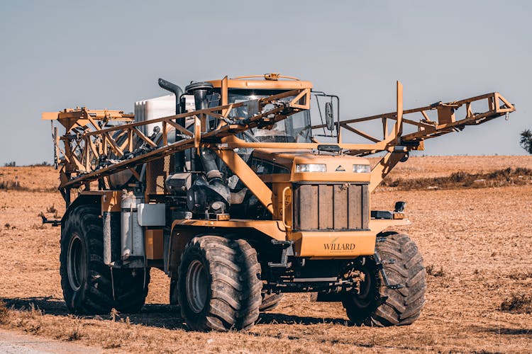 A Self-propelled Sprayer Tractor In A Farm