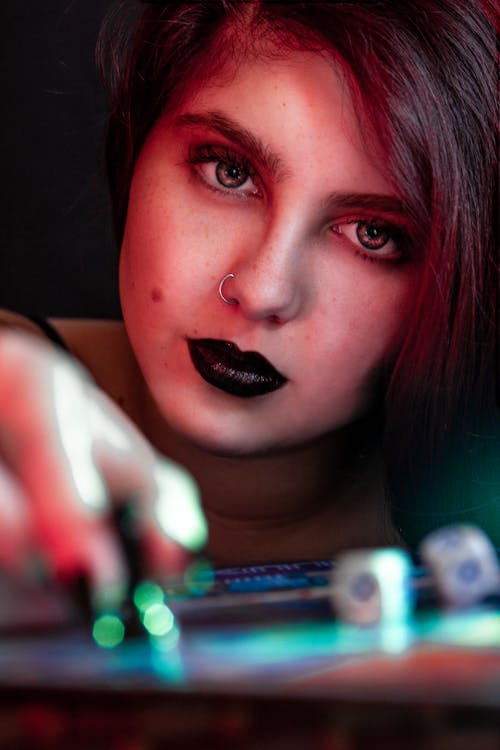 Free Portrait of a Woman with Black Lips Looking at the Camera Stock Photo