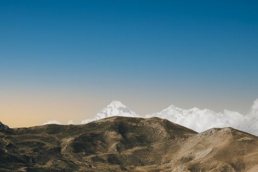 Stunning view of snow-capped peaks in Nepal with clear blue skies.