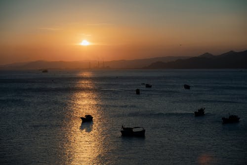 Безкоштовне стокове фото на тему «Захід сонця, море, океан»