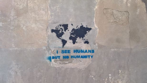 White and Blue Quote on Gray Concrete Wall