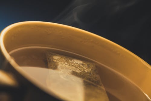 Brown Ceramic Cup With Tea