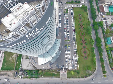 High-angle aerial shot of Arfa Software Technology Park showcasing its modern architecture and surrounding area.