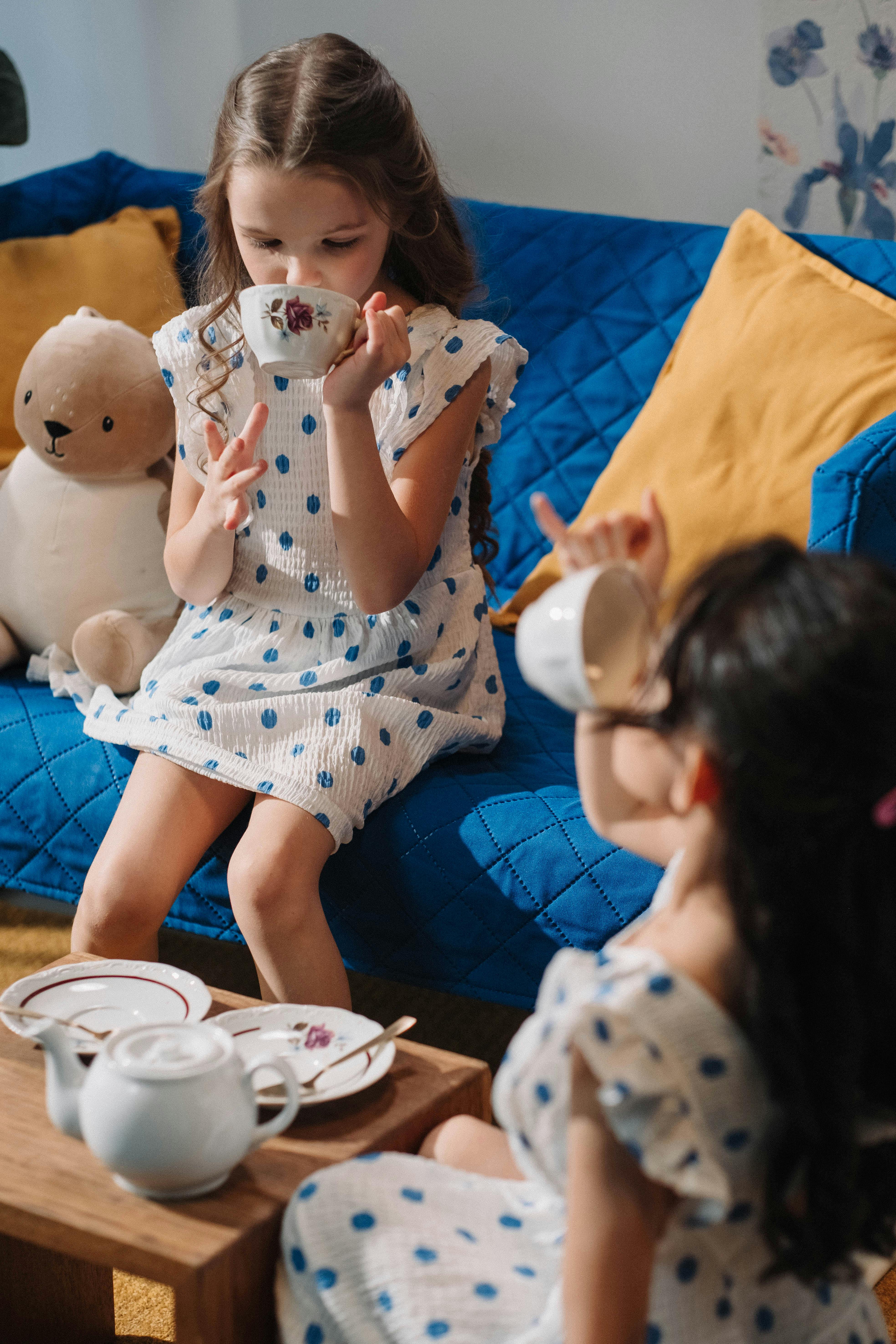 kids holding a cup playing