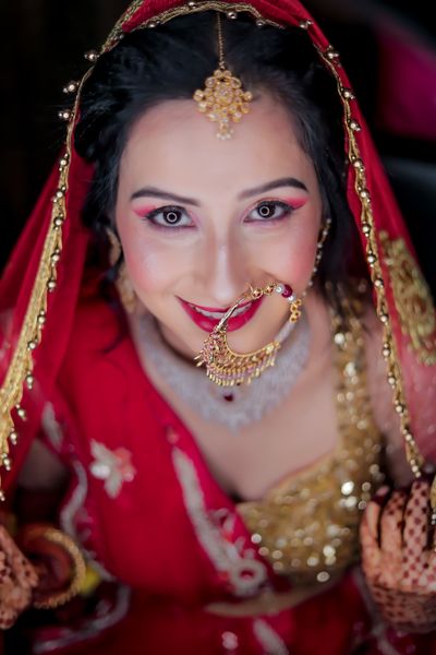 Smiling bride with golden nose ring