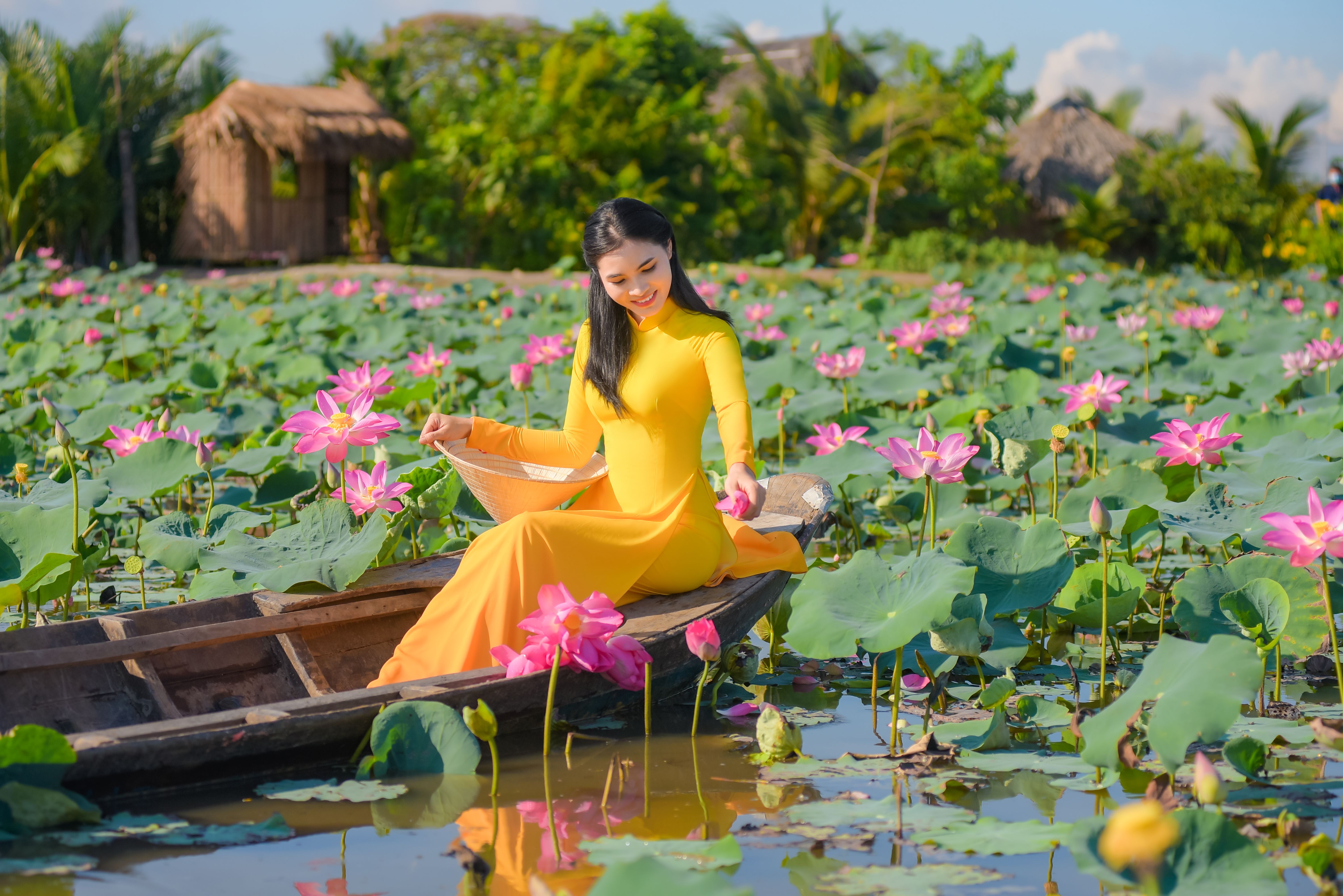 Woman in Yellow Dress sitting on a Boat · Free Stock Photo