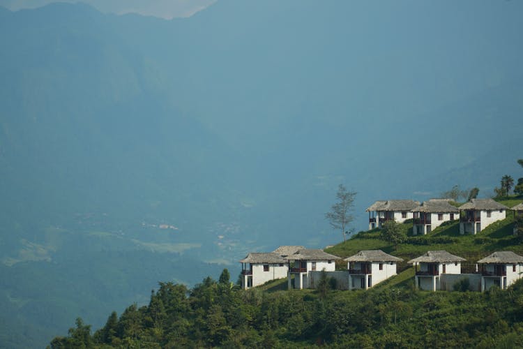 Row Of Small Houses On A Forest Mountain