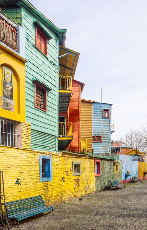 Free Vibrant street scene of colorful buildings in La Boca, Buenos Aires. Stock Photo