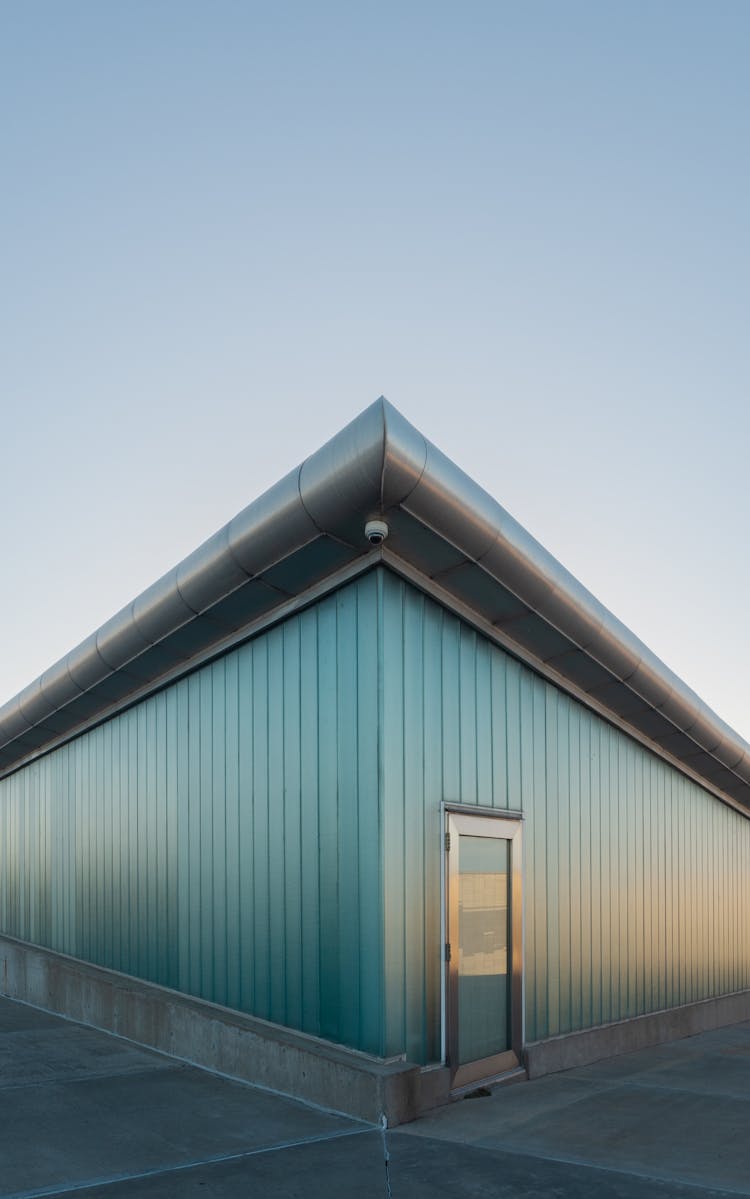 The Corner Of A Building With Glass Walls