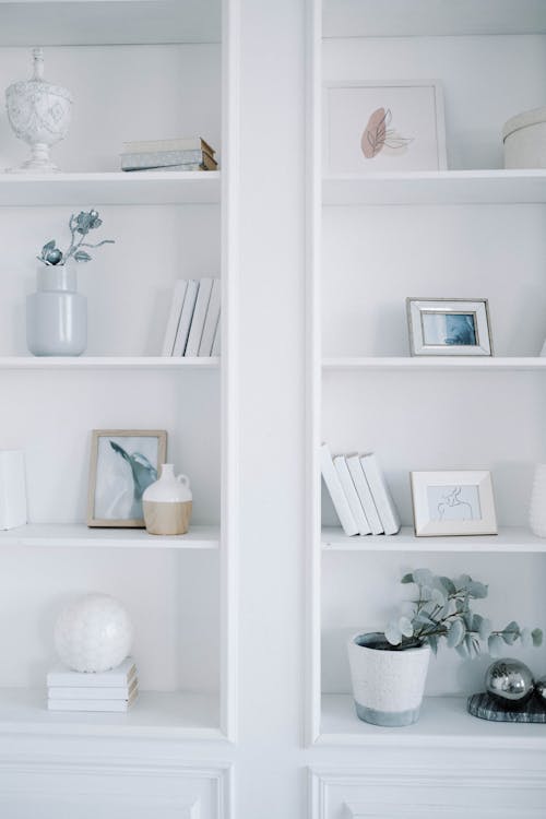 Free White Wooden Shelf With Books and Flowers Stock Photo