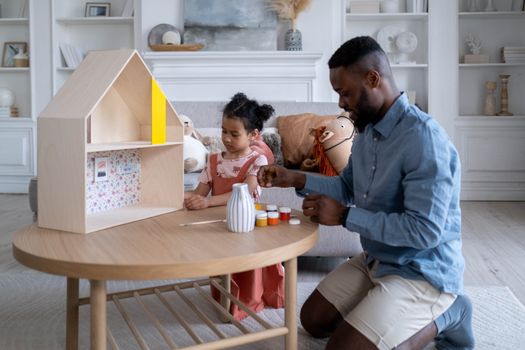 A Father Playing with His Daughter