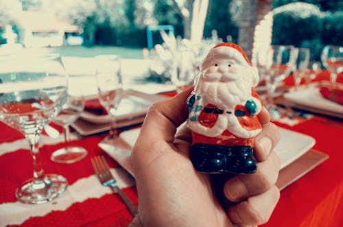 Free Person Holding Santa Claus Figurine Stock Photo