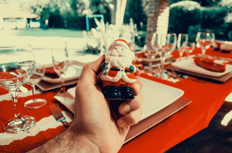 A styled Christmas table with plates and greenery