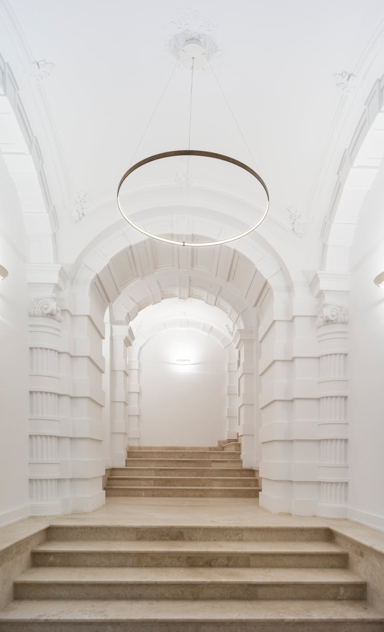 Stairs In White Corridor