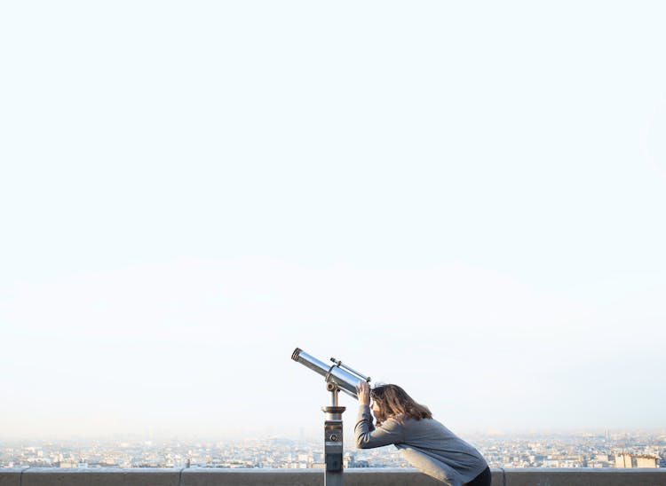 Woman Using Telescope