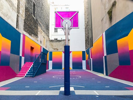 Vibrant geometric street basketball court in Paris, showcasing modern urban art.