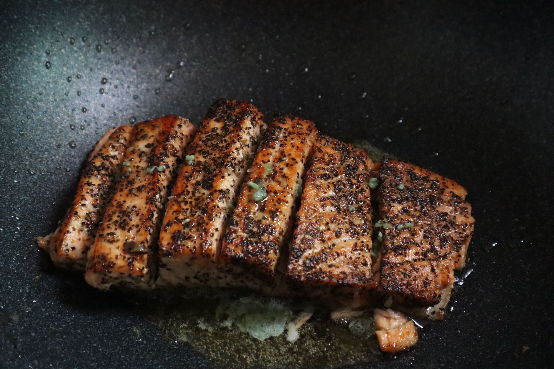 Cooking Salmon Fillets salmon fillets sizzling in skillet