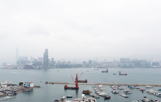 Vibrant cityscape of Hong Kong's urban skyline and busy harbor.