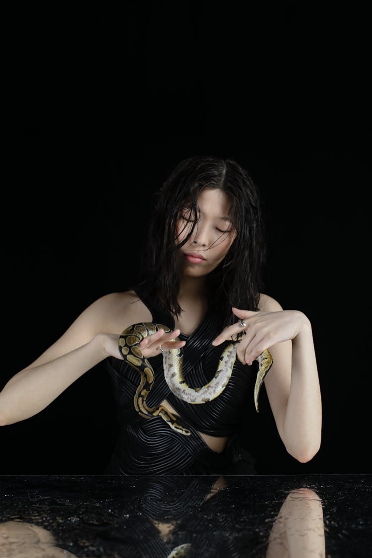 Woman Holding A Dangerous Snake