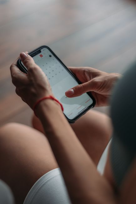 smartphone checking concert schedule