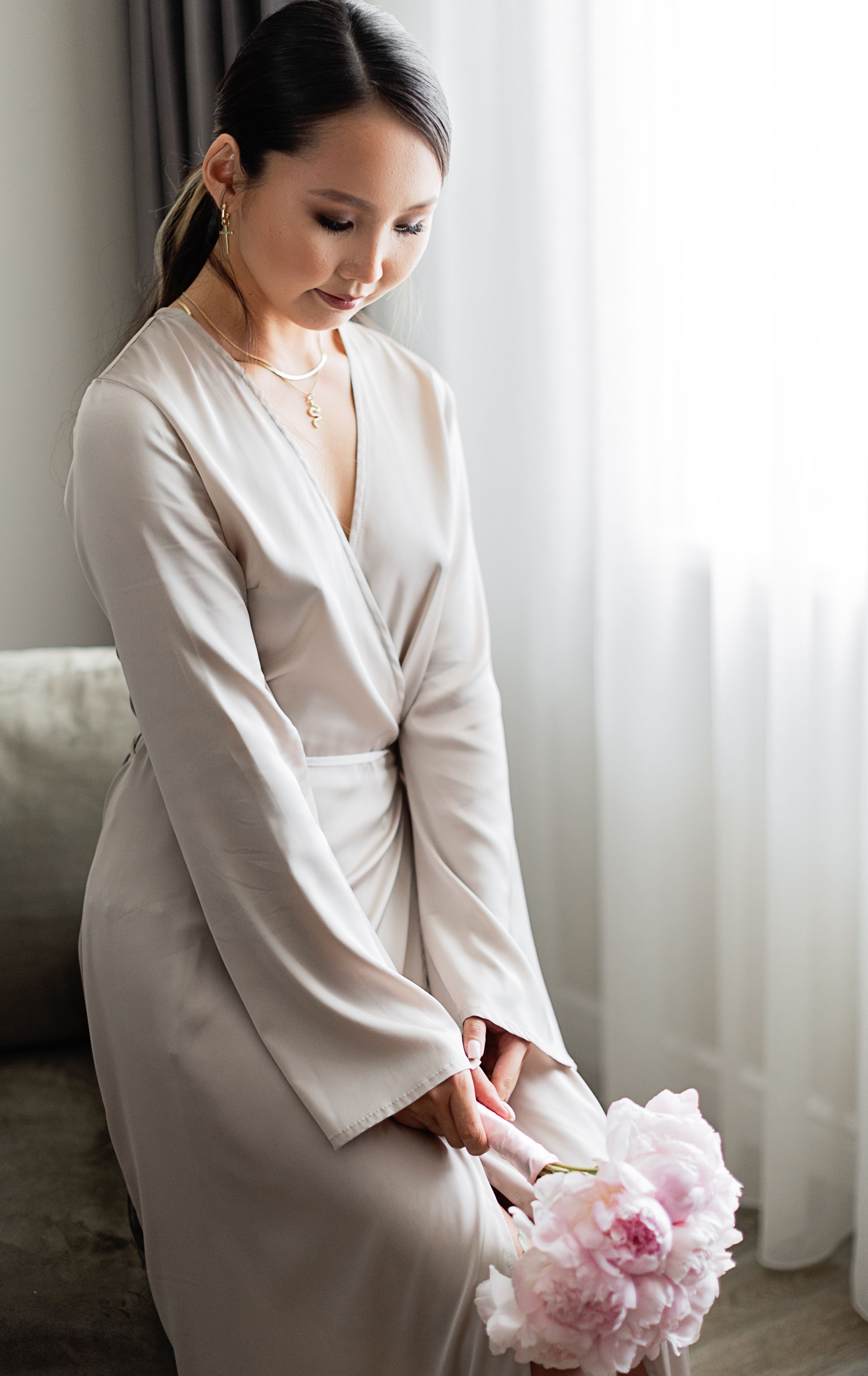 Woman in White Dress Holding a Bouquet of Flowers · Free Stock Photo