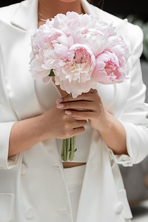 Person Holding Peony Flower Bouquet