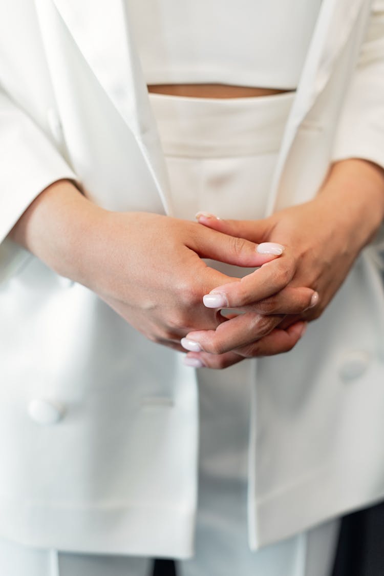 Intertwined Fingers Of A Womans Hands