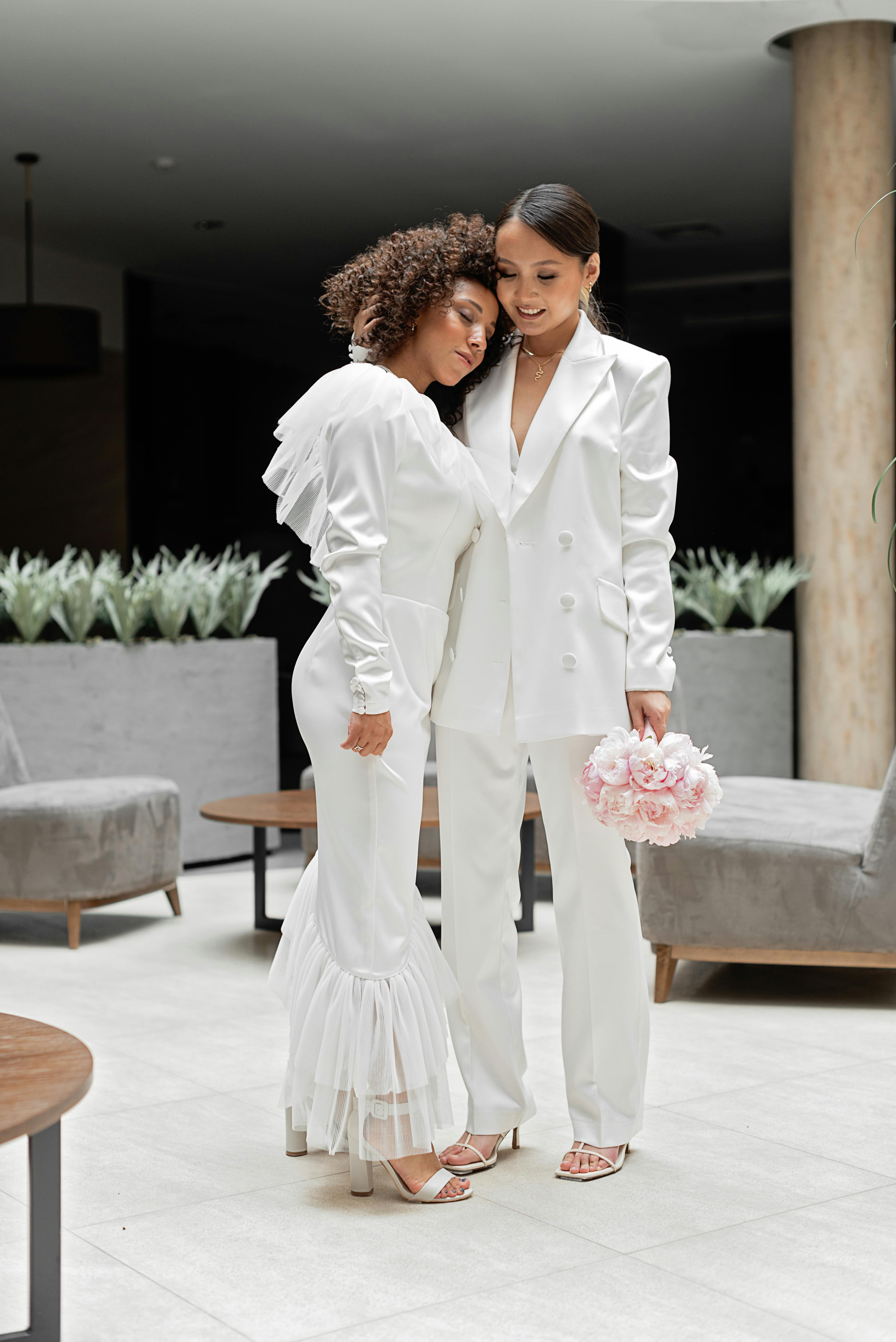 women in white formal wear