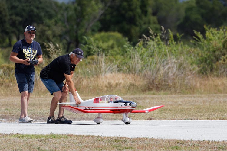 Men With Remote Controlled Airplane