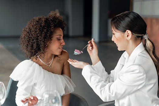 A heartwarming wedding moment between two brides enjoying their reception.