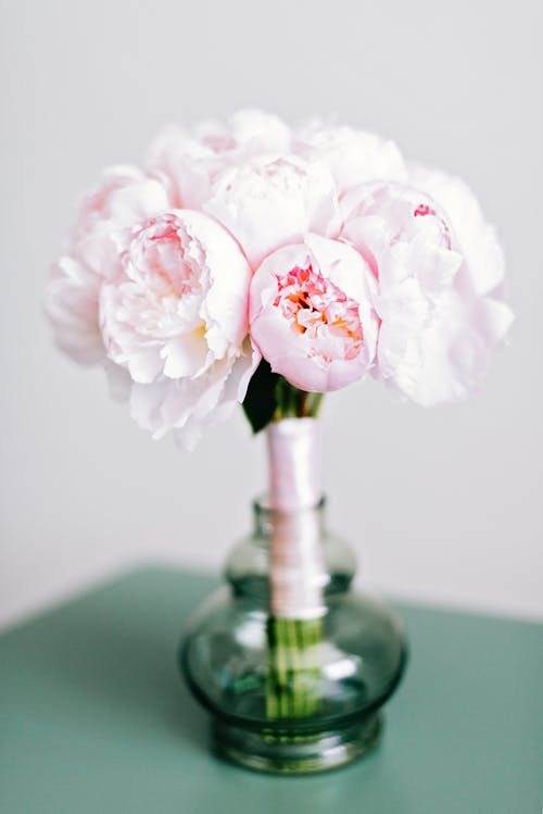 Pink and White Flowers in Green Glass Vase