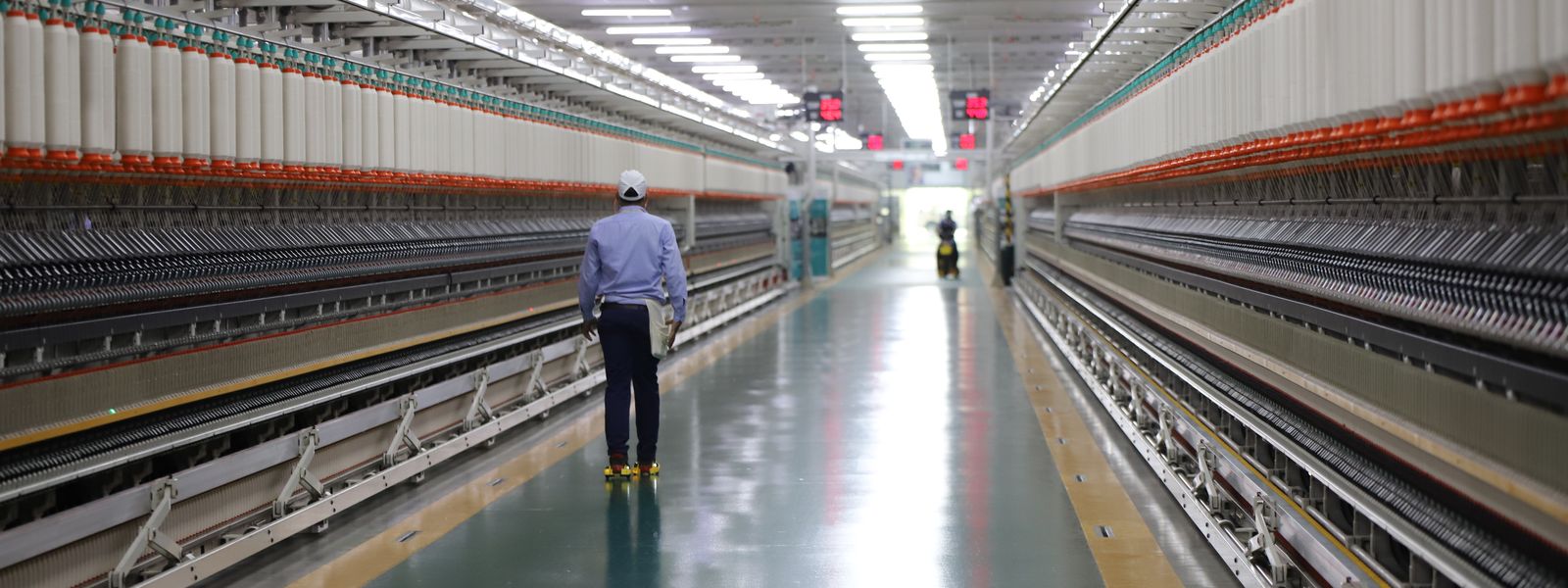 Worker walking through an industrial plant in India