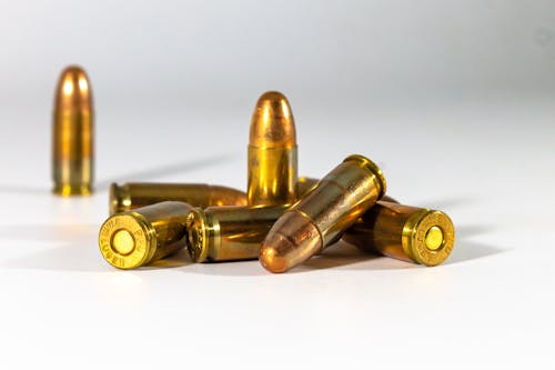 Free Gold Bullets on White  Stock Photo