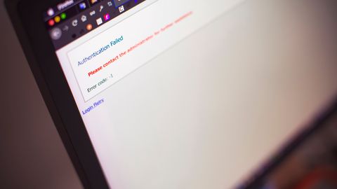 Close-up of a computer screen displaying an authentication failed message.