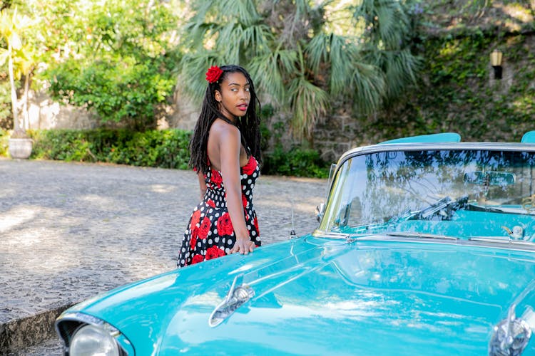 A Woman Touching The Car