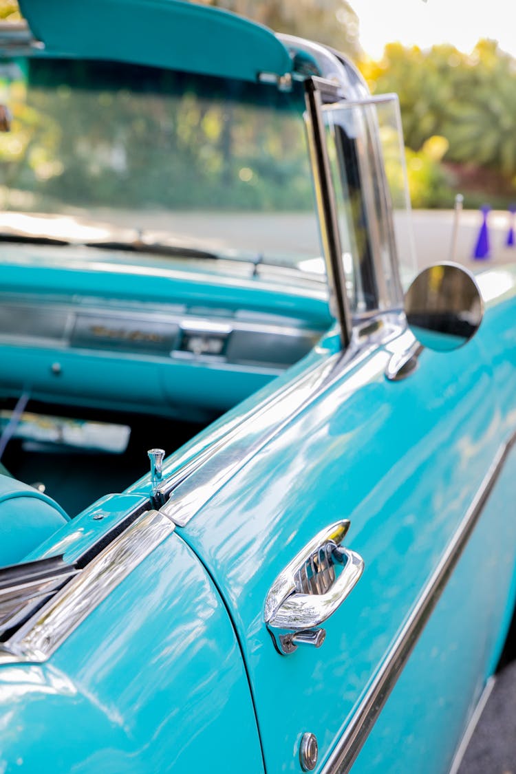 A Blue Car Door With A Silver Handle