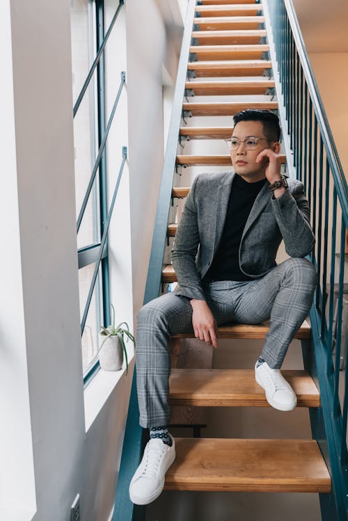 Free A Man Sitting on the Stairs Stock Photo